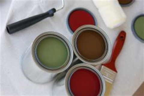 Paint cans and paint brush