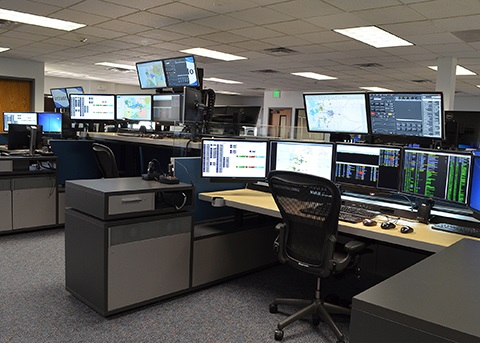 Computers and a desk inside the Weld County Regional Communications Center.